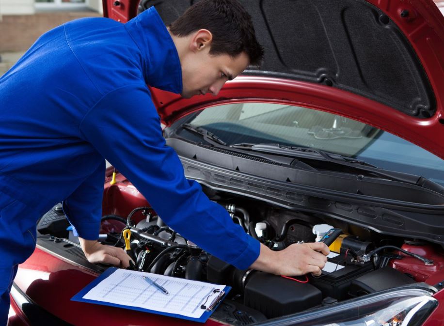 Mechanic looking at engine